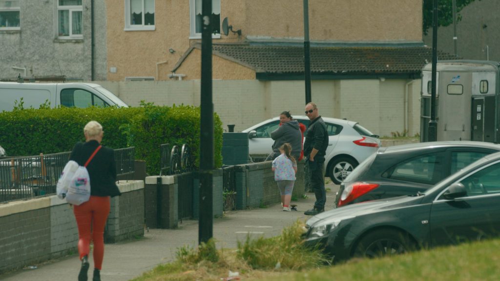 Children playing and pedestrians walking in a Dublin cul-de-sac on a residential street