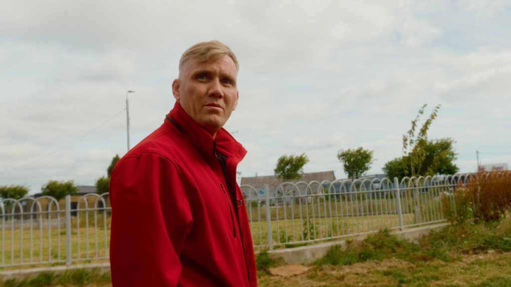 Daniel Jones, a community outreach worker, captured mid-conversation during fieldwork