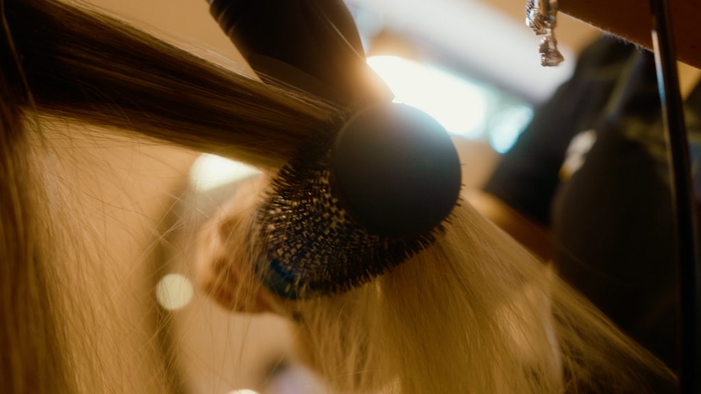 Close-up of hair being styled during beauty course at Discovery Centre in Darndale