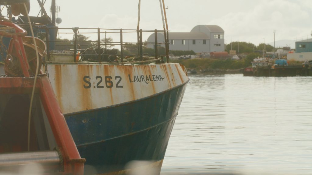 Telephoto shot of the Lauralena fishing trawler at Castletown Bere Harbor, showcasing hull and equipment