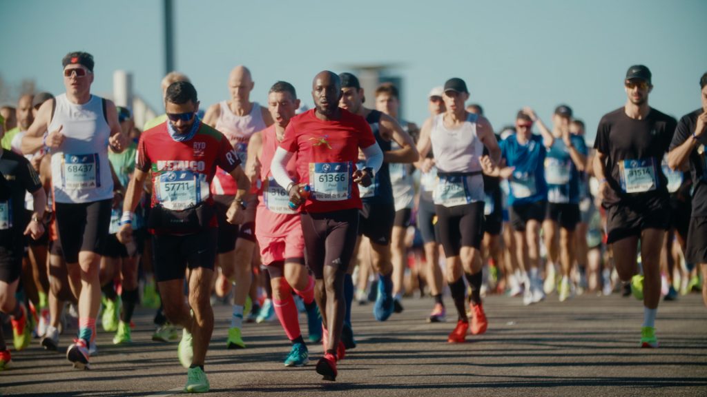 Compressed telephoto view of runners packed tightly at Berlin Marathon