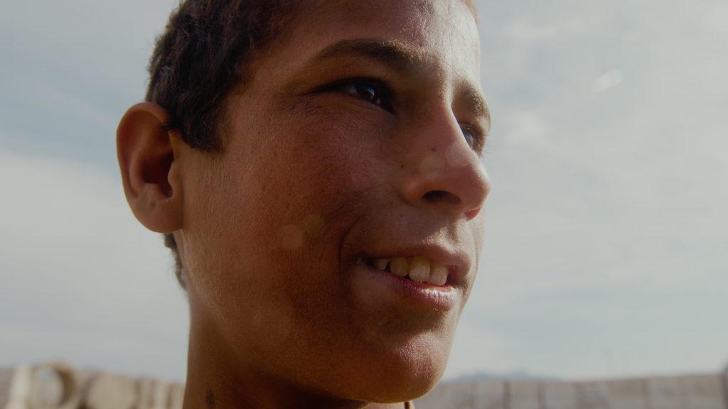 Close-up of boy playing cricket on the streets of Jalalabad, Afghanistan