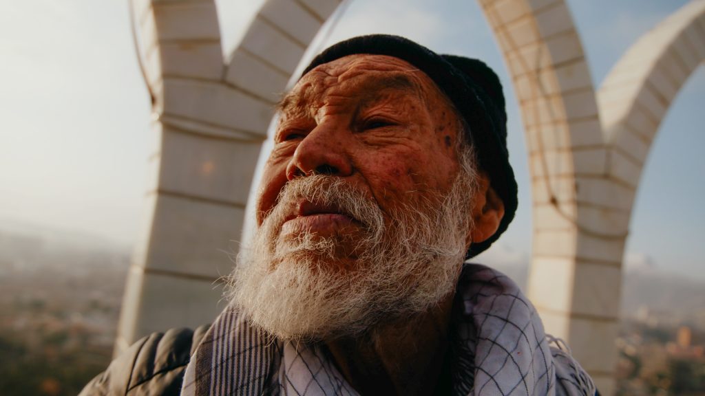 Low wide shot of man in Kabul