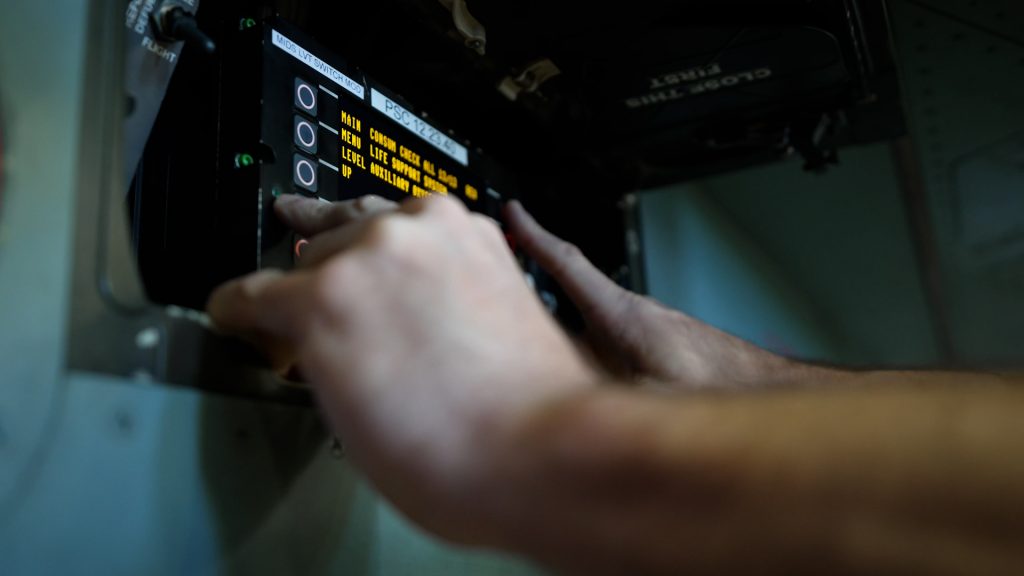 Close-up of mechanic inspecting Eurofighter computer during maintenance check